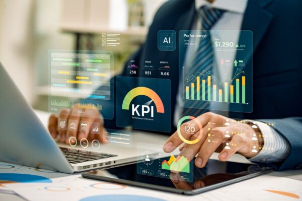 AI for Tech Leaders: Man analyzing KPIs and performance data on a tablet.