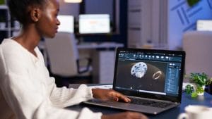 AI for Product Management: Woman using AI on laptop. Product design and development with AI.