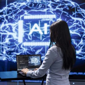 AI for Programmers: Woman coding with AI brain graphic. Artificial intelligence development concept.