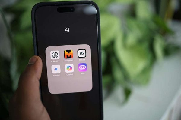 AI for Frontline End-users. Smartphone showing AI apps: ChatGPT, Mistral AI, Claude, Gemini, Copilot, and Poe.