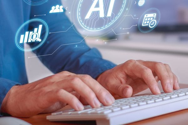 Hands typing on keyboard with AI icons. Beginner machine learning concept.