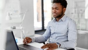 Adult Matric isiZulu Home Language student studies on laptop. Online learning, education concept.