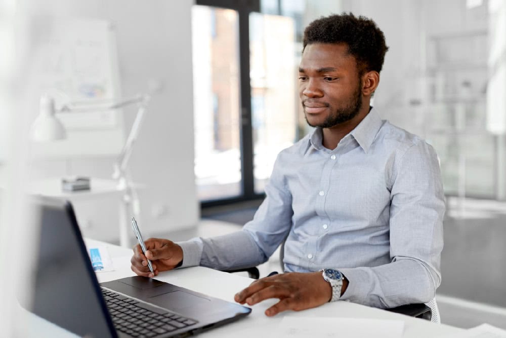 Adult Matric isiZulu Home Language student studies on laptop. Online learning, education concept.