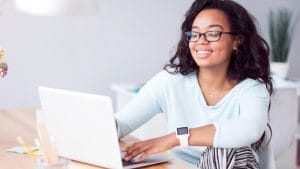 Adult matric physical science student studying online with laptop. Education and e-learning concept.