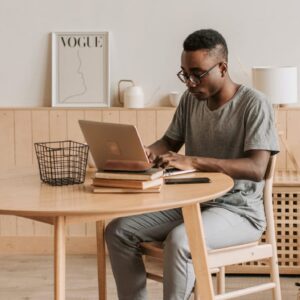 Bookkeeping training: Man studies on laptop. Further Education and Training Certificate in Bookkeeping.