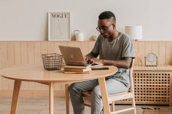 Bookkeeping training: Man studies on laptop. Further Education and Training Certificate in Bookkeeping.