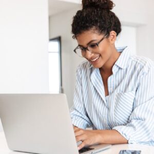 Office Administration student working on a laptop. Higher Certificate in Office Admin.