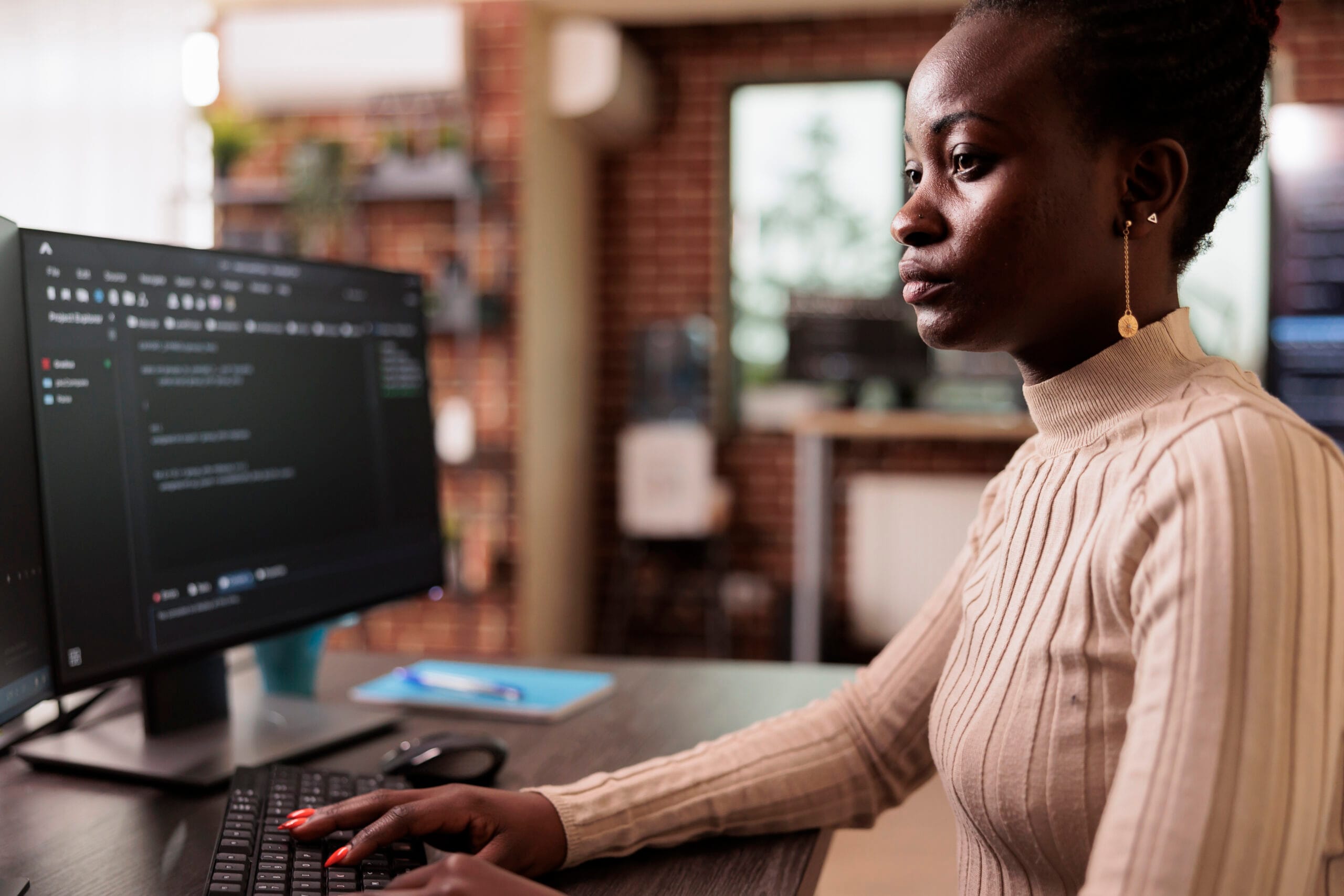 Woman coding Swift. Programmer at computer. Swift beginner to intermediate level.