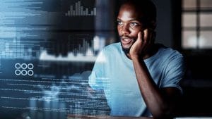CISA professional analyzing data. Certified Information Systems Auditor examining charts and code.