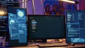 Machine learning programmer setup. Multiple monitors displaying code. ML architect workstation.