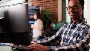 Six Sigma Black Belt candidate working at computer. CSSBB certification.