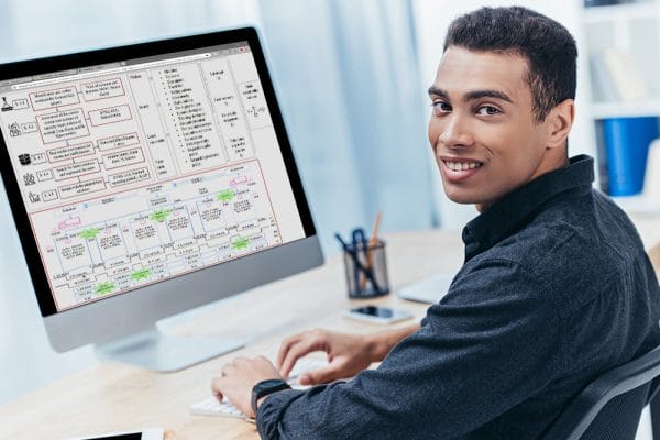 Six Sigma Green Belt certification. Man working on DMAIC process on computer.