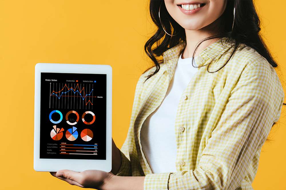 Social Media Strategist journey: Woman holding tablet with data charts. Marketing analytics and strategy.